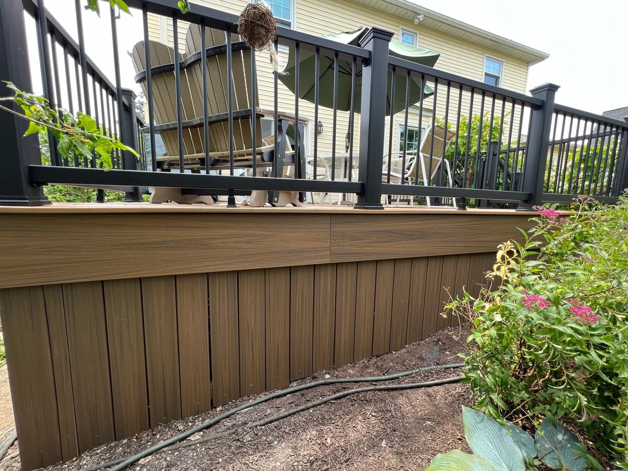 Vertical skirting beneath the deck edge.